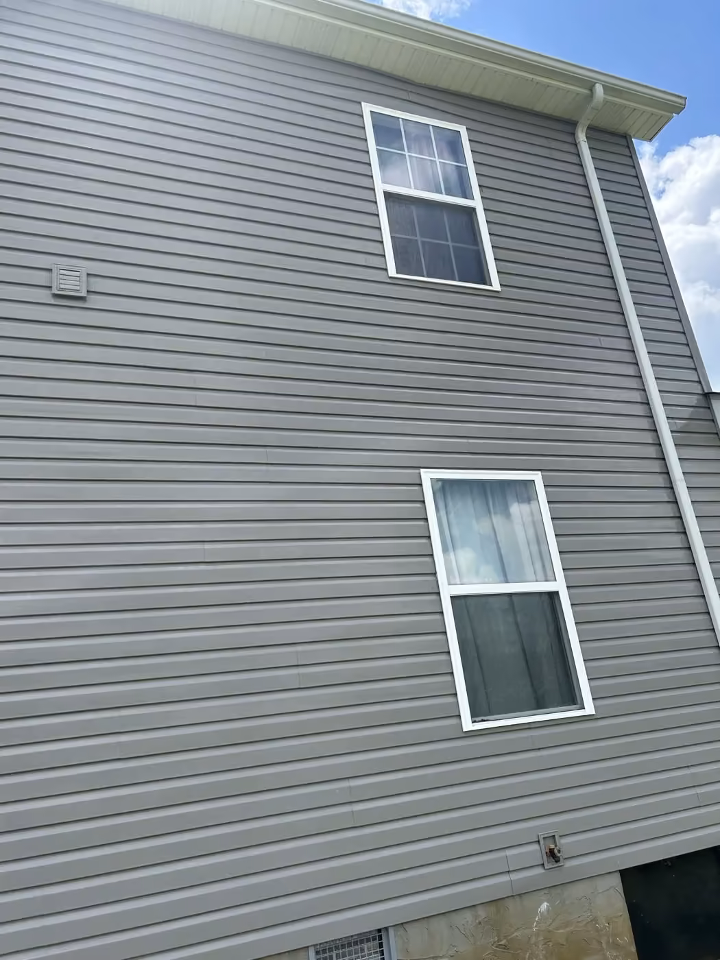 Siding on the same Crossville-area home after soft washing.