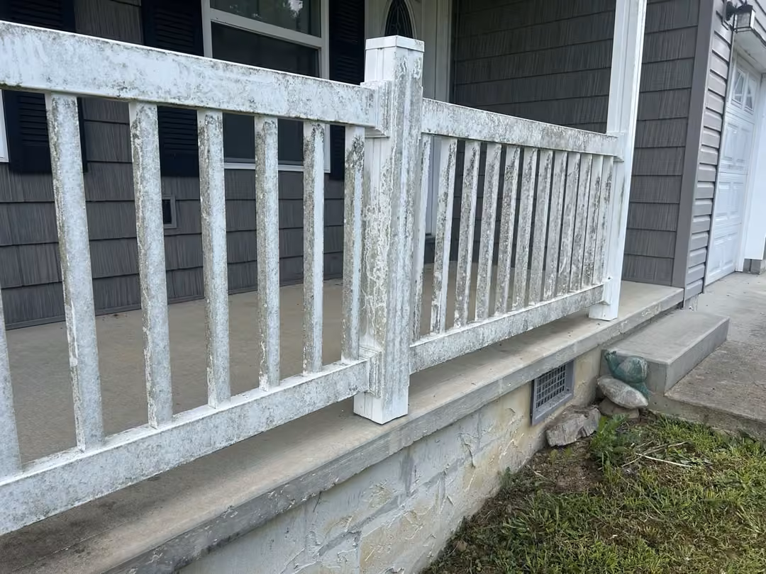 Dirty porch railing before cleaning on a Crossville-area home.