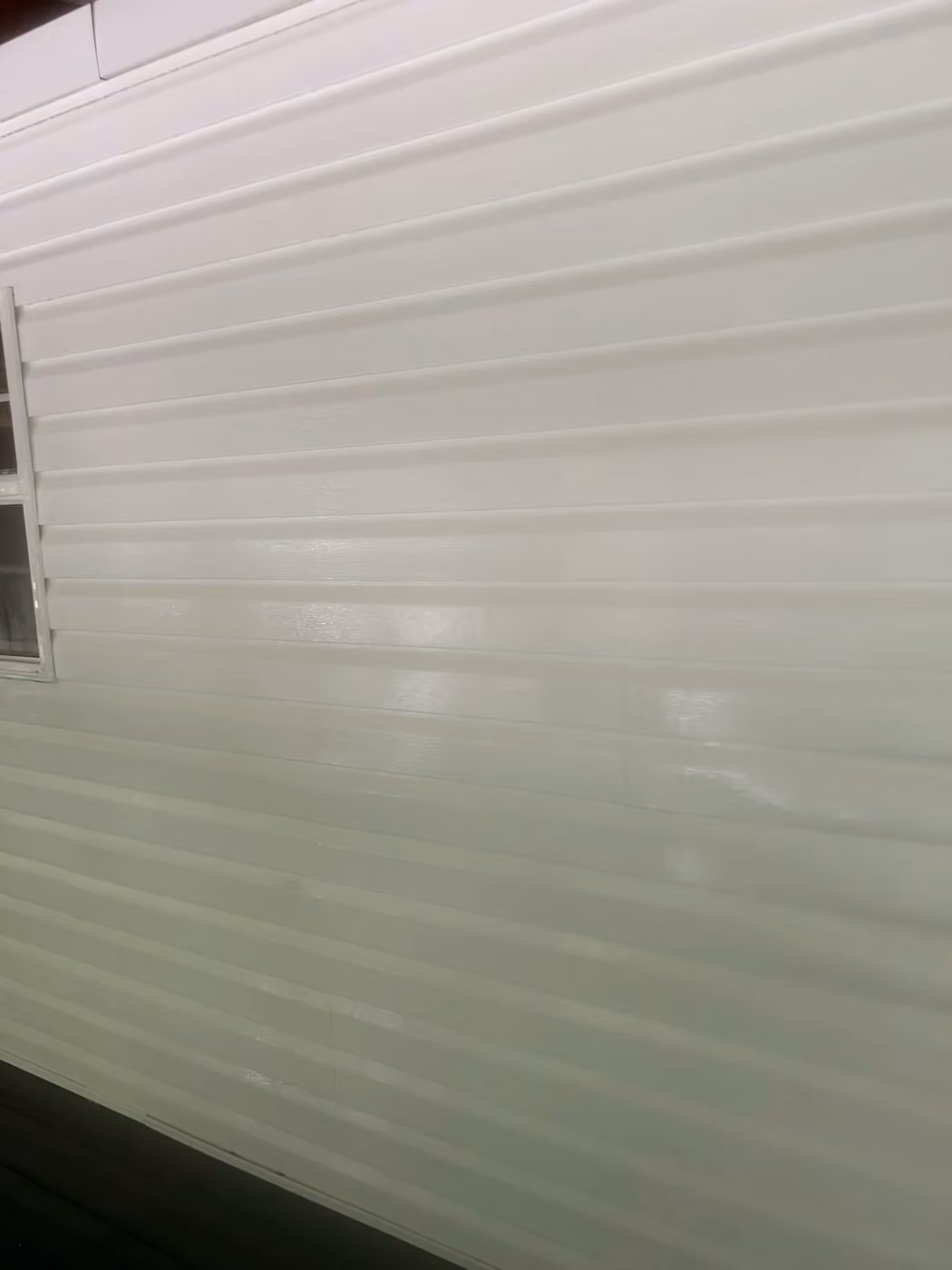 Clean vinyl siding after soft washing at the same Crossville-area job.